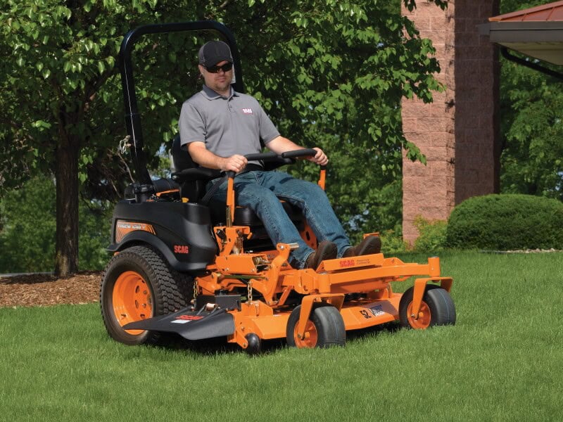 man cutting with scag zero turn mower